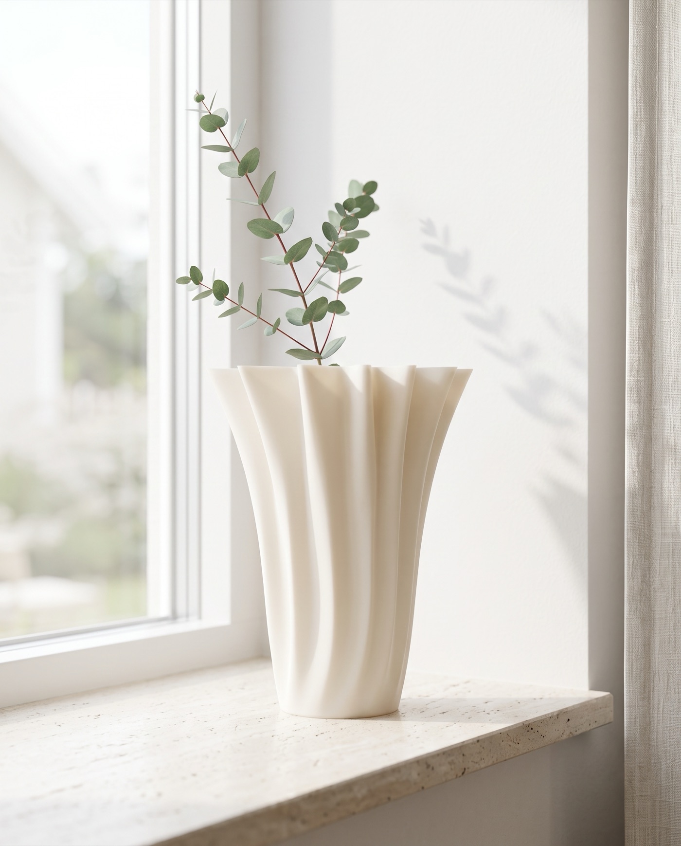 Astoma vase with eucalyptus on a travertine windowsill in soft morning light
