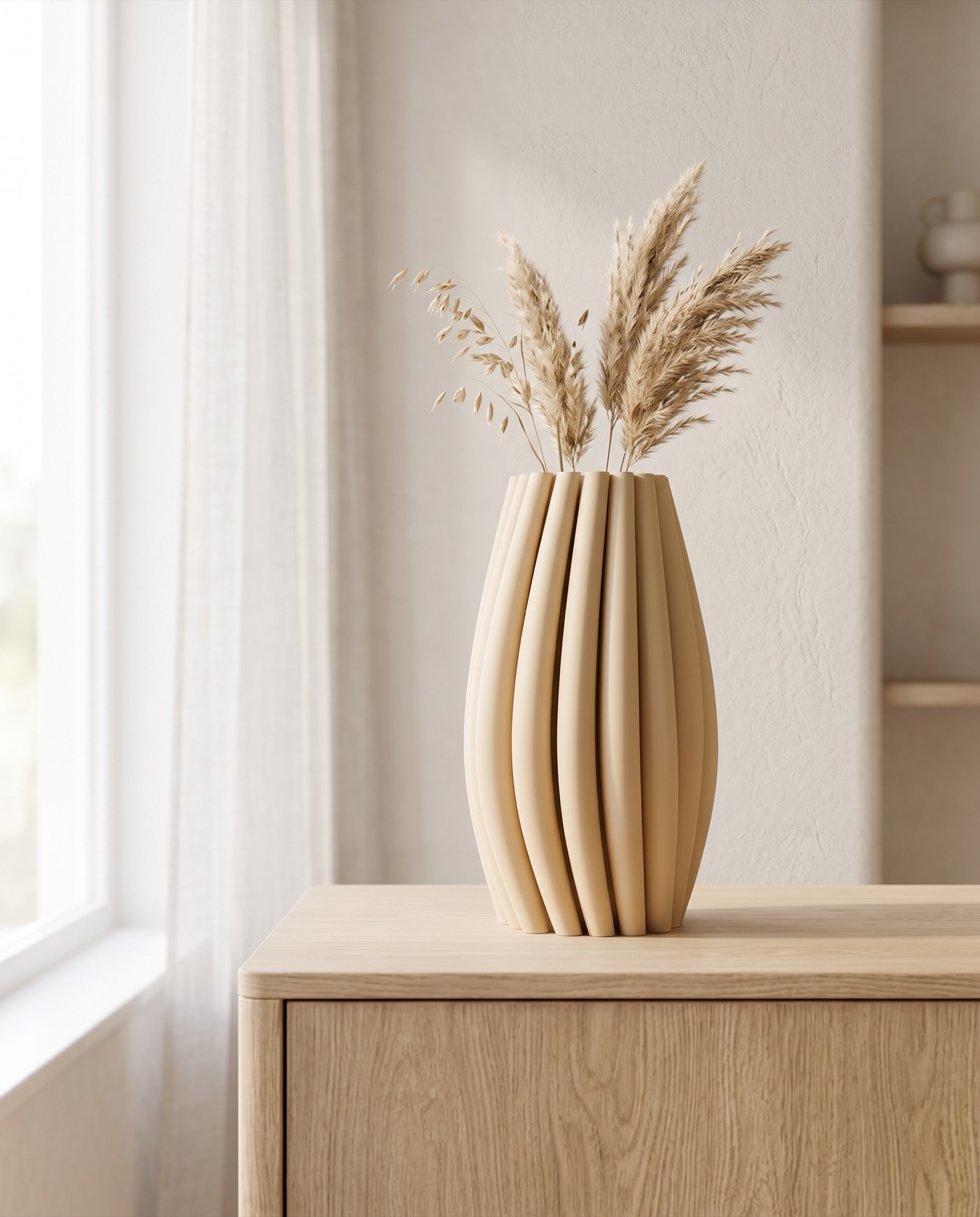 Soma vase with dried grasses on a pale oak sideboard